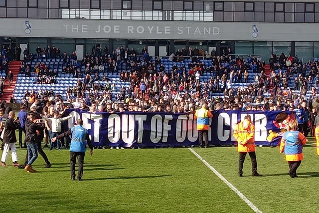 Protesting fans stormed the pitch as Oldham were losing to Salford before dropping out of the Football League (Lee Morris/PA)
