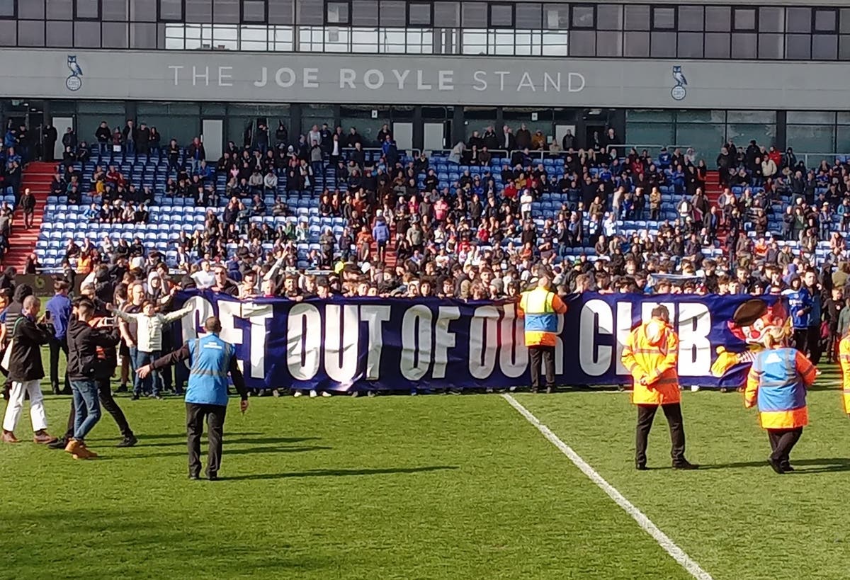 Oldham to ban fans who invaded pitch during defeat that confirmed relegation