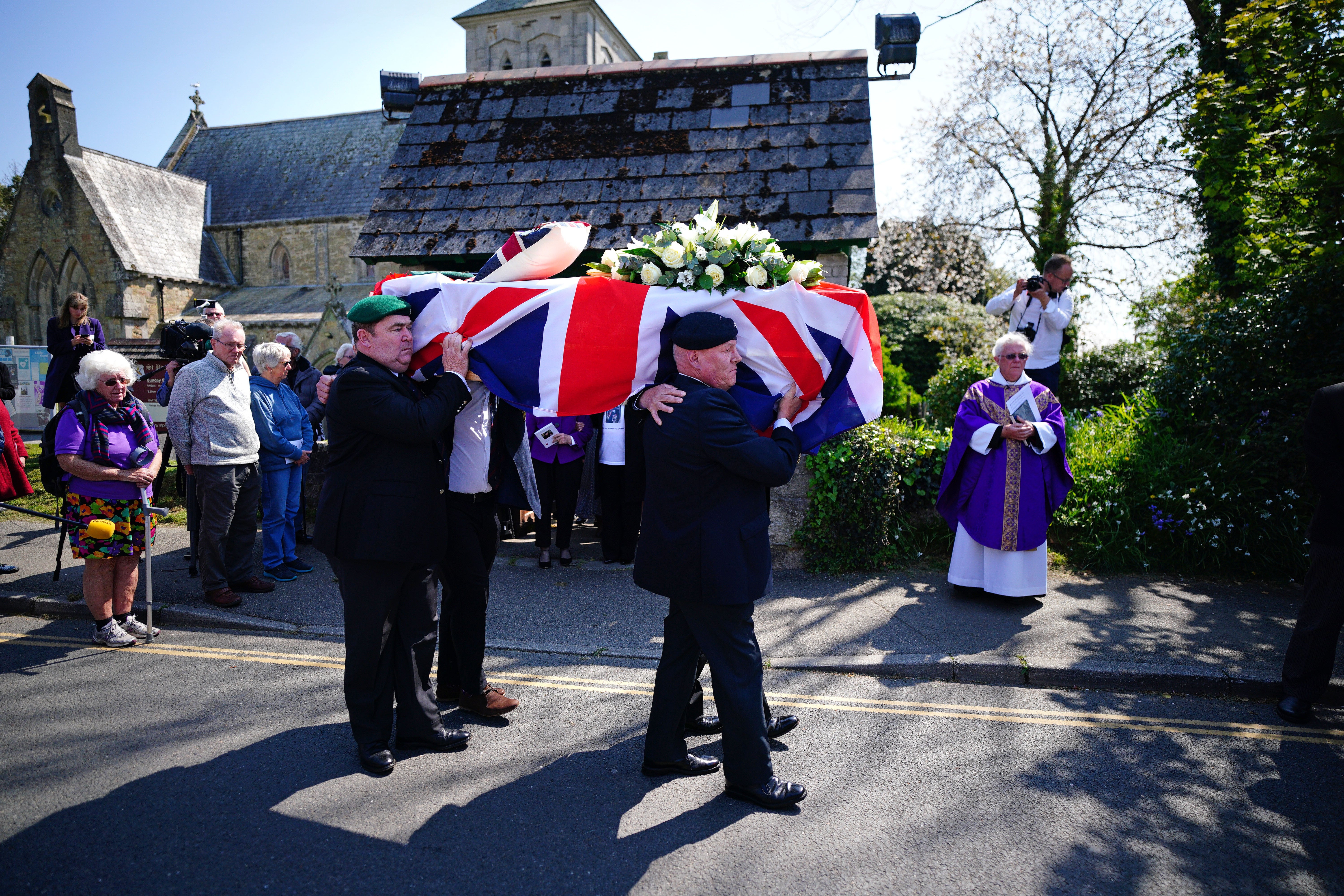The coffin of 96-year-old Mr Billinge is carried out of St Paul’s Church in Charlestown, Cornwall (Ben Birchall/PA)