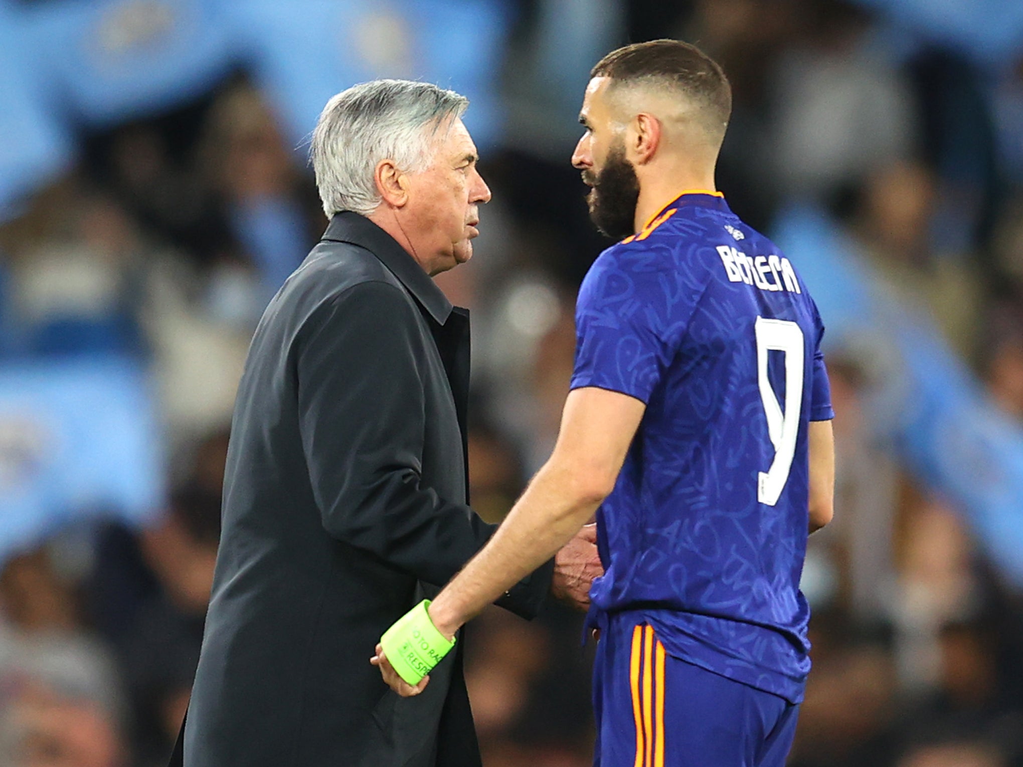 Carlo Ancelotti embraces Karim Benzema after the seven-goal thriller