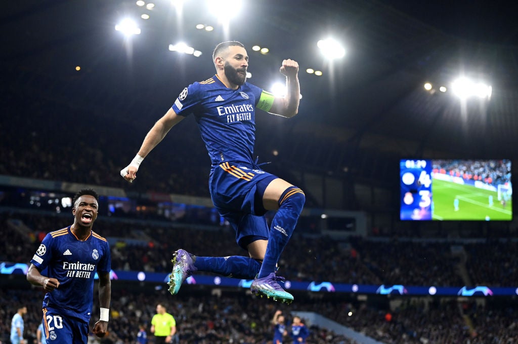 Karim Benzema celebrates his late penalty at the Etihad