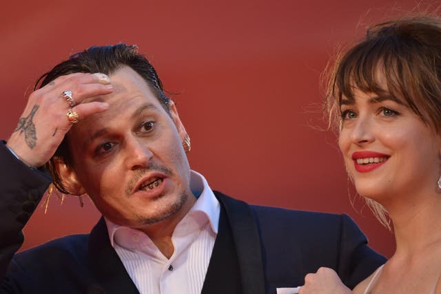 <p>Johnny Depp and Dakota Johnson</p>
