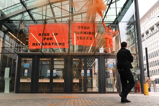 <p>An Axe Drax protester outside the Department for Business, Energy and Industrial Strategy.  </p>