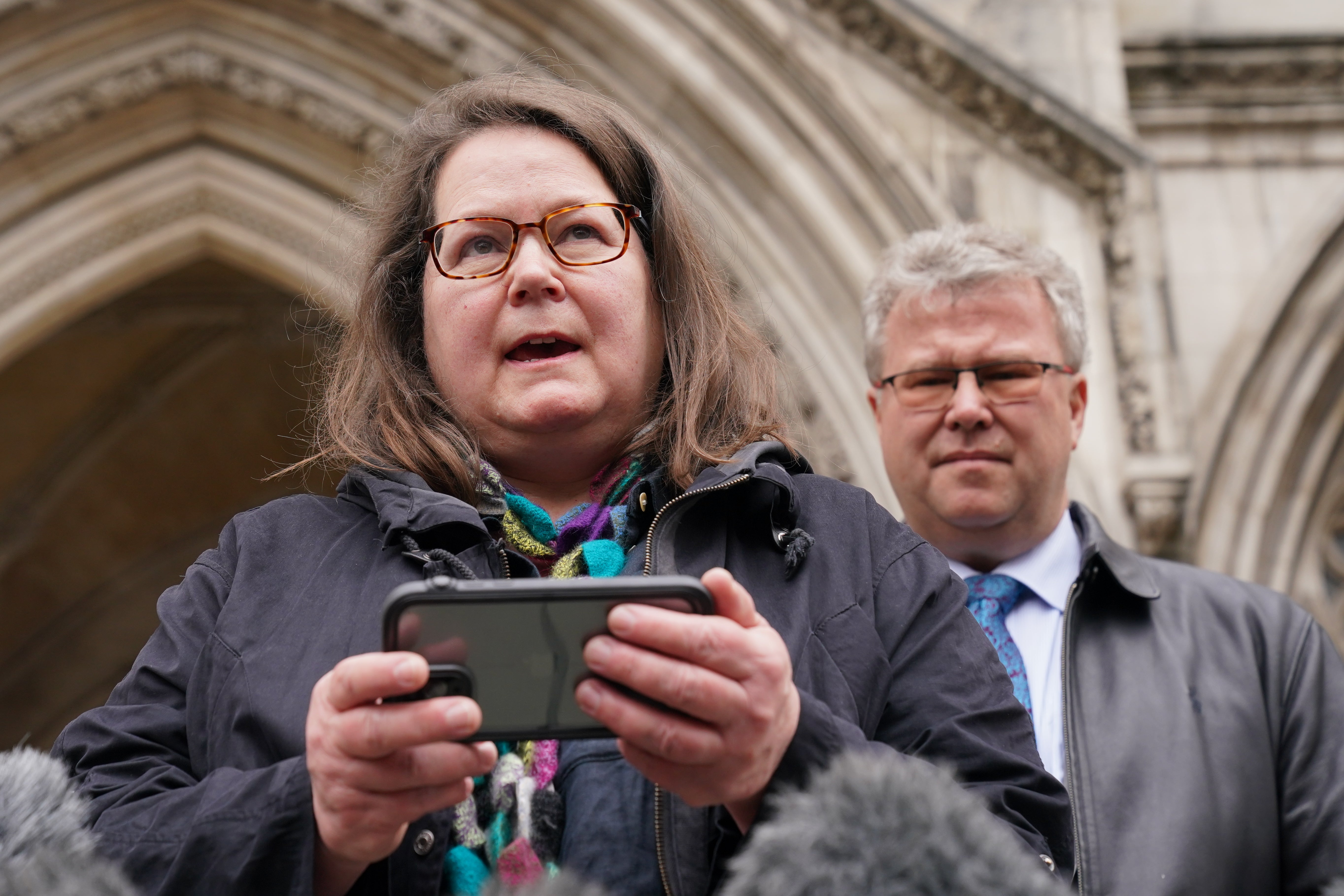 Fay Harris, whose father died from Covid-19, speaking outside the Royal Courts of Justice