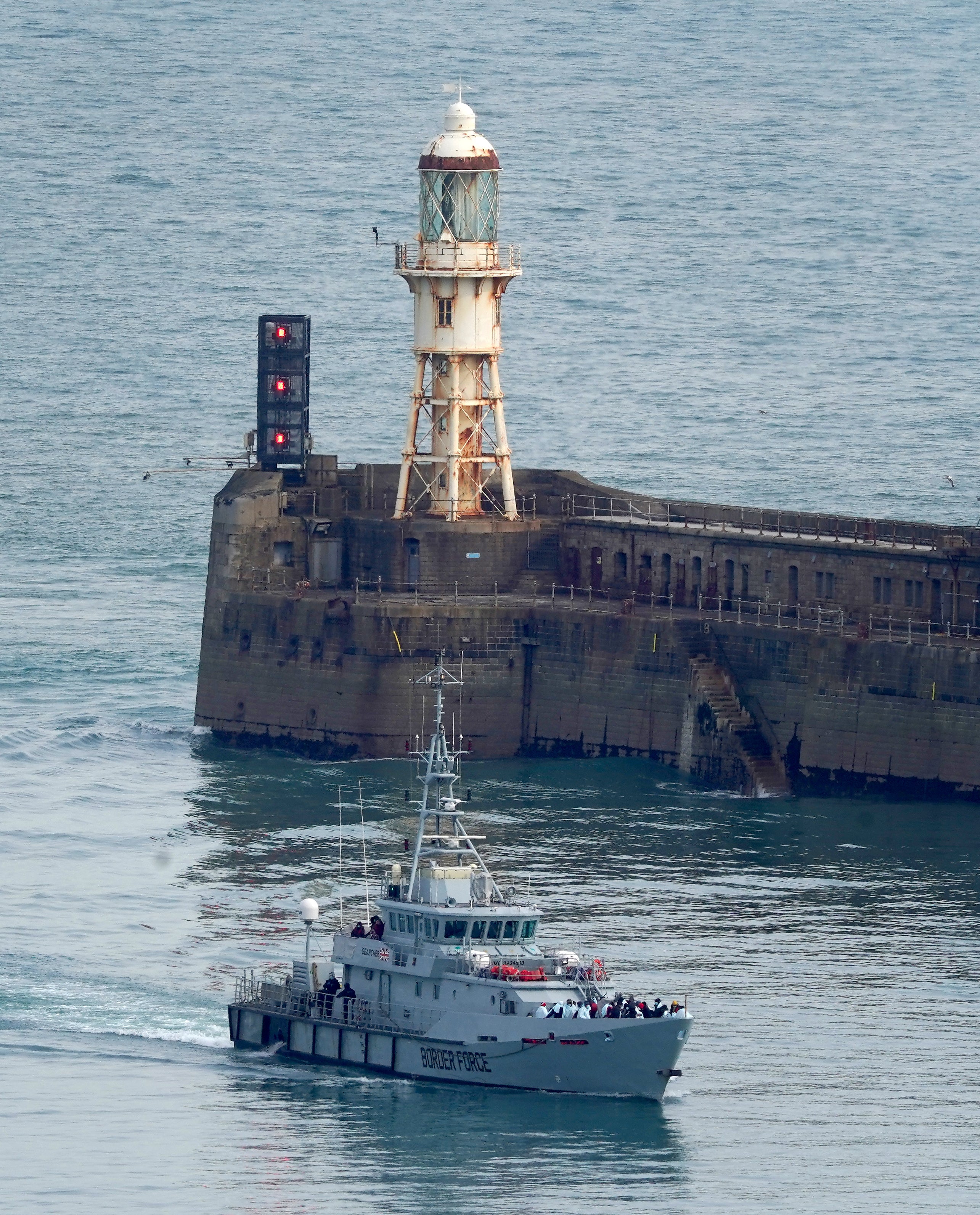 A group of people thought to be migrants are brought in to Dover (Gareth Fuller/PA)