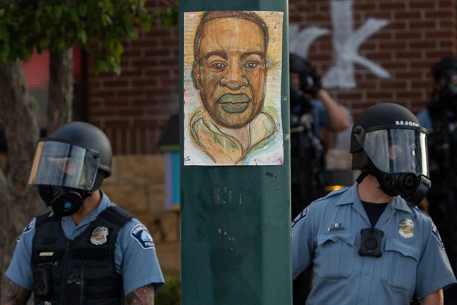 <p>Minneapolis police stand outside the department's 3rd Precinct on May 27, 2020, in Minneapolis</p>