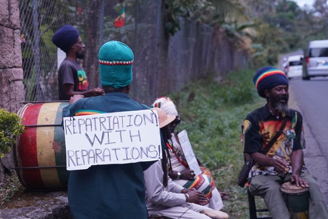 A small protest outside the Fond Doux Cocoa Plantation in Saint Lucia during the visit by the Earl and the Countess of Wessex (Joe Giddens/PA)