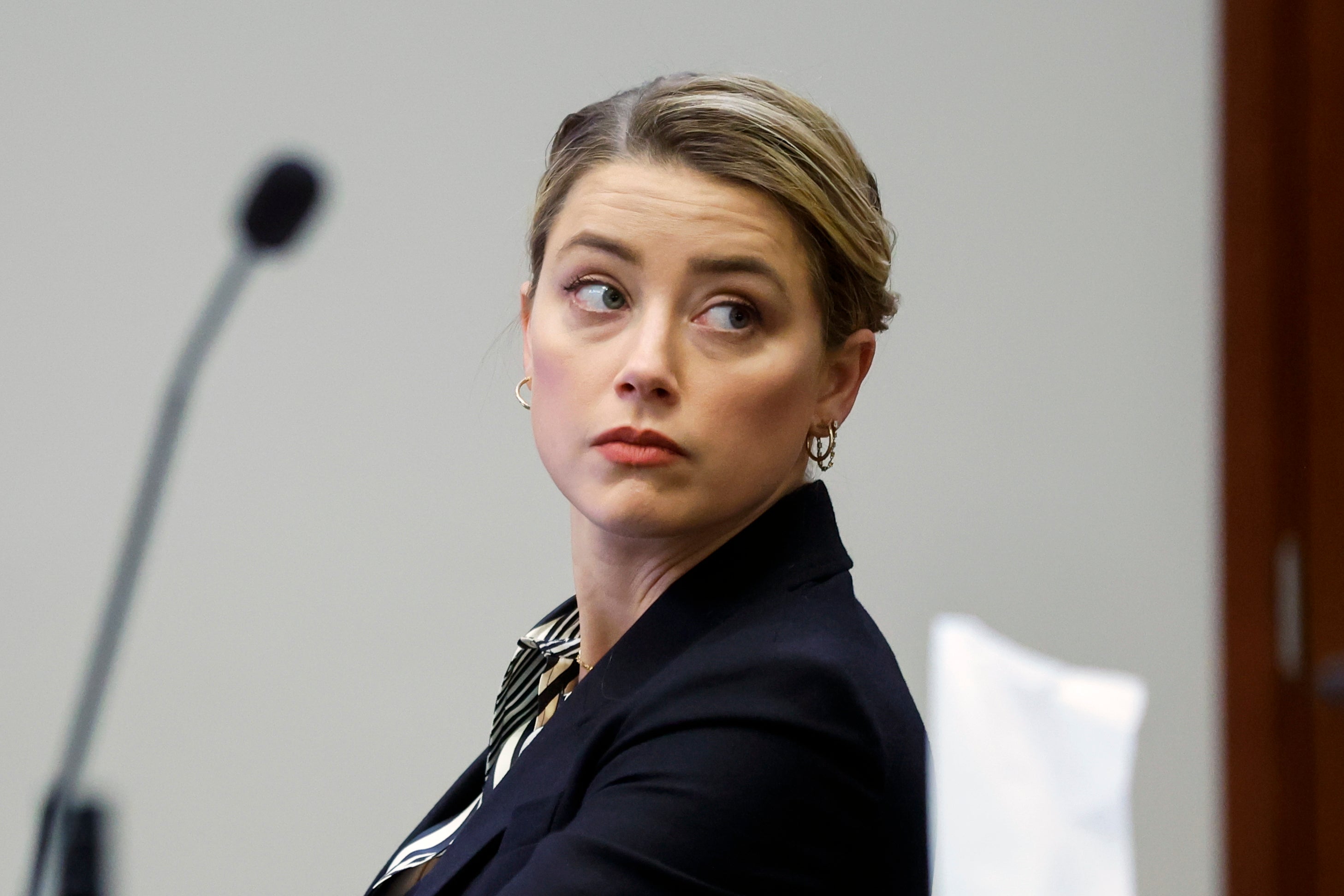 Actor Amber Heard listens in the courtroom at the Fairfax County Circuit Court in Fairfax, Va., Wednesday, April 27, 2022