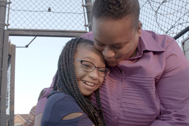 <p>Tomika Daniel and her daughter reunite outside of a prison in Ohio.</p>