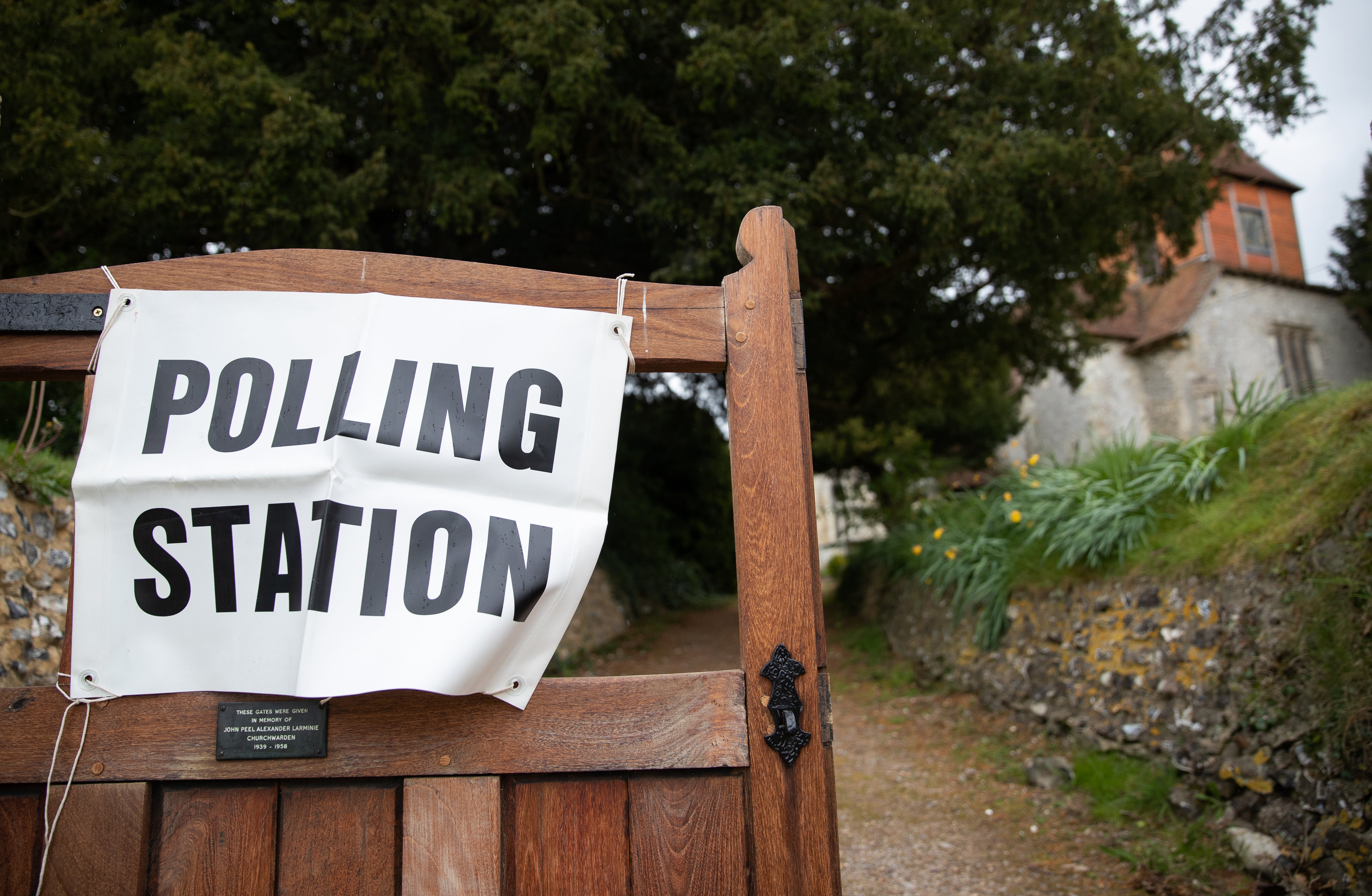 A polling station sign outside All Saints Church in Monk Sherborne, Hampshire