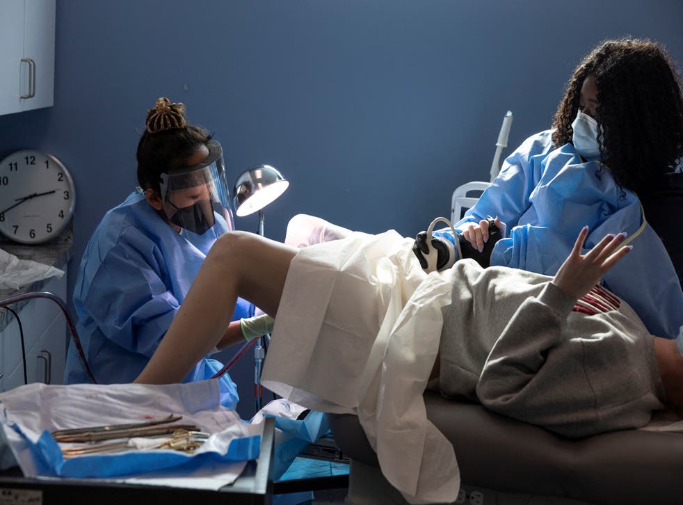 <p>Dr Shelly Tien performs an abortion while a nurse assists with ultrasound during the procedure at Planned Parenthood in Birmingham, Alabama</p>