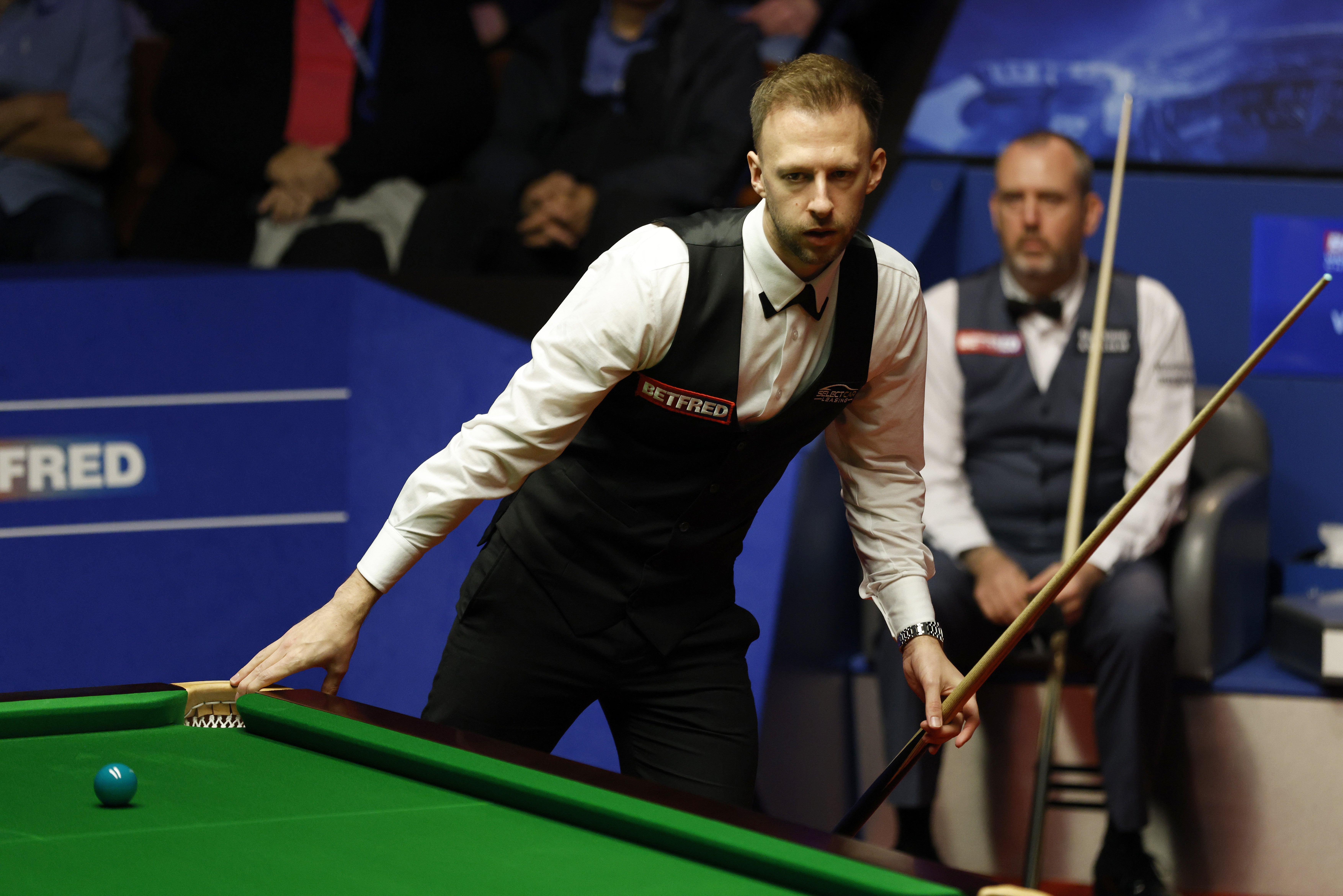 Judd Trump (left) took control in the opening session of his World Championship semi-final against Mark Williams (right)