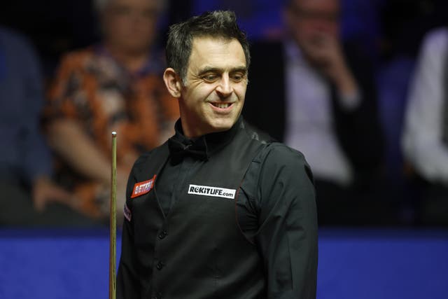 Ronnie O’Sullivan smiles after fighting back from three downs to draw level at 4-4 against John Higgins (Richard Sellers/PA)