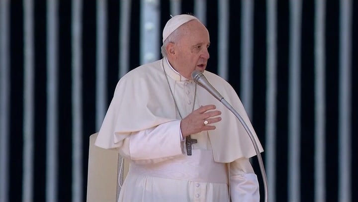 Pope apologises for sitting during general audience due to knee pain ...