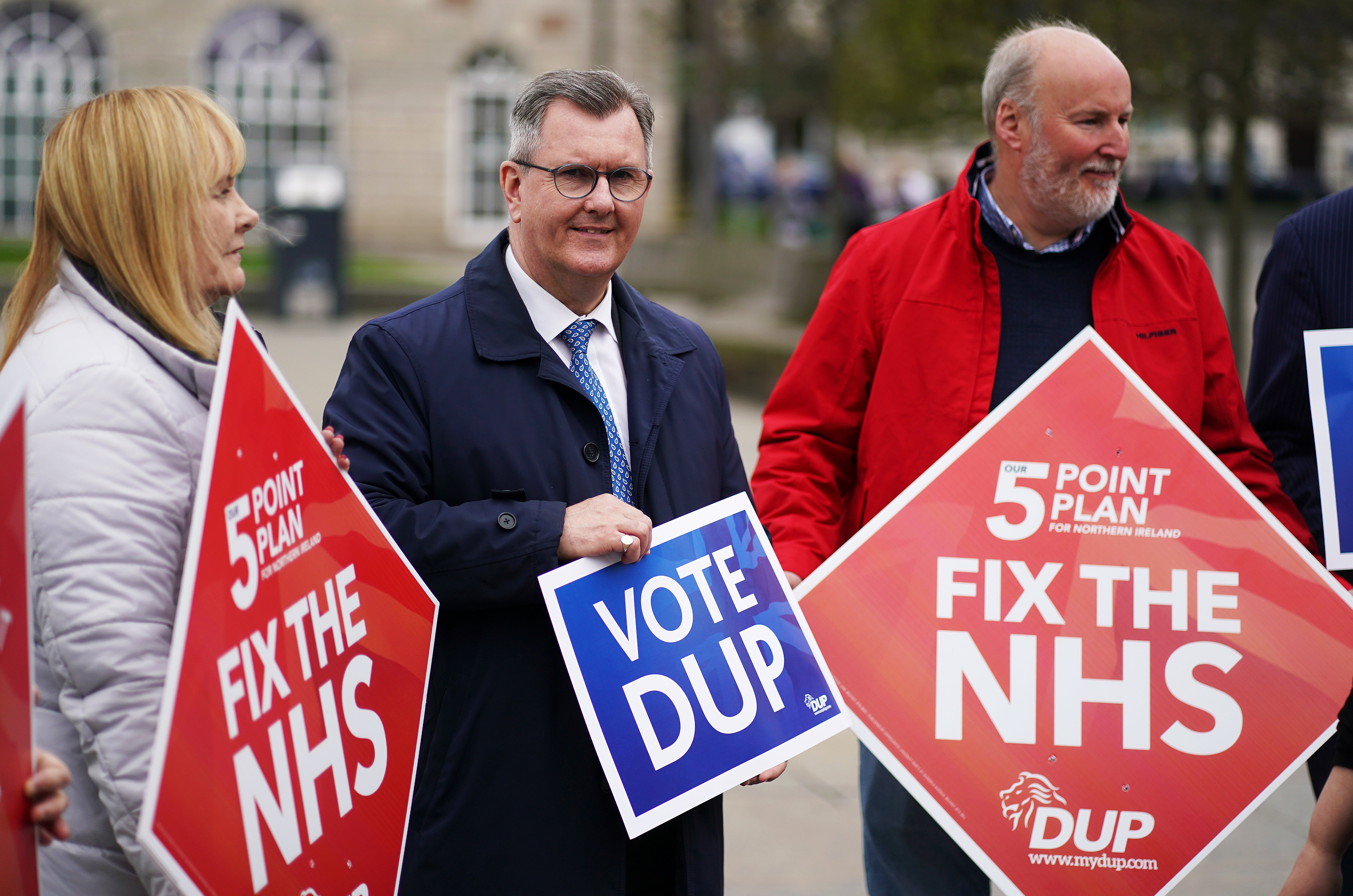 DUP leader Sir Jeffrey Donaldson (centre) on the campaign trail (Brian Lawless/PA)