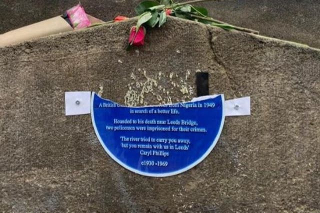 <p>A temporary plaque installed to replace the stolen original has been torn in two </p>