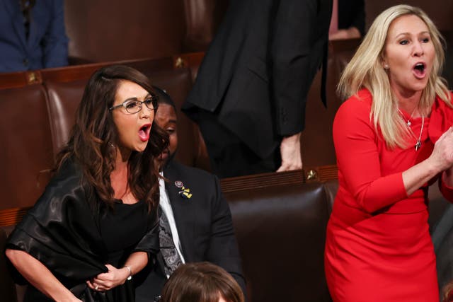 <p>U.S. Rep. Lauren Boebert (R-CO) and Rep. Marjorie Taylor Greene (R-GA) scream "Build the Wall" as U.S. President Joe Biden delivers the State of the Union address during a joint session of Congress </p>