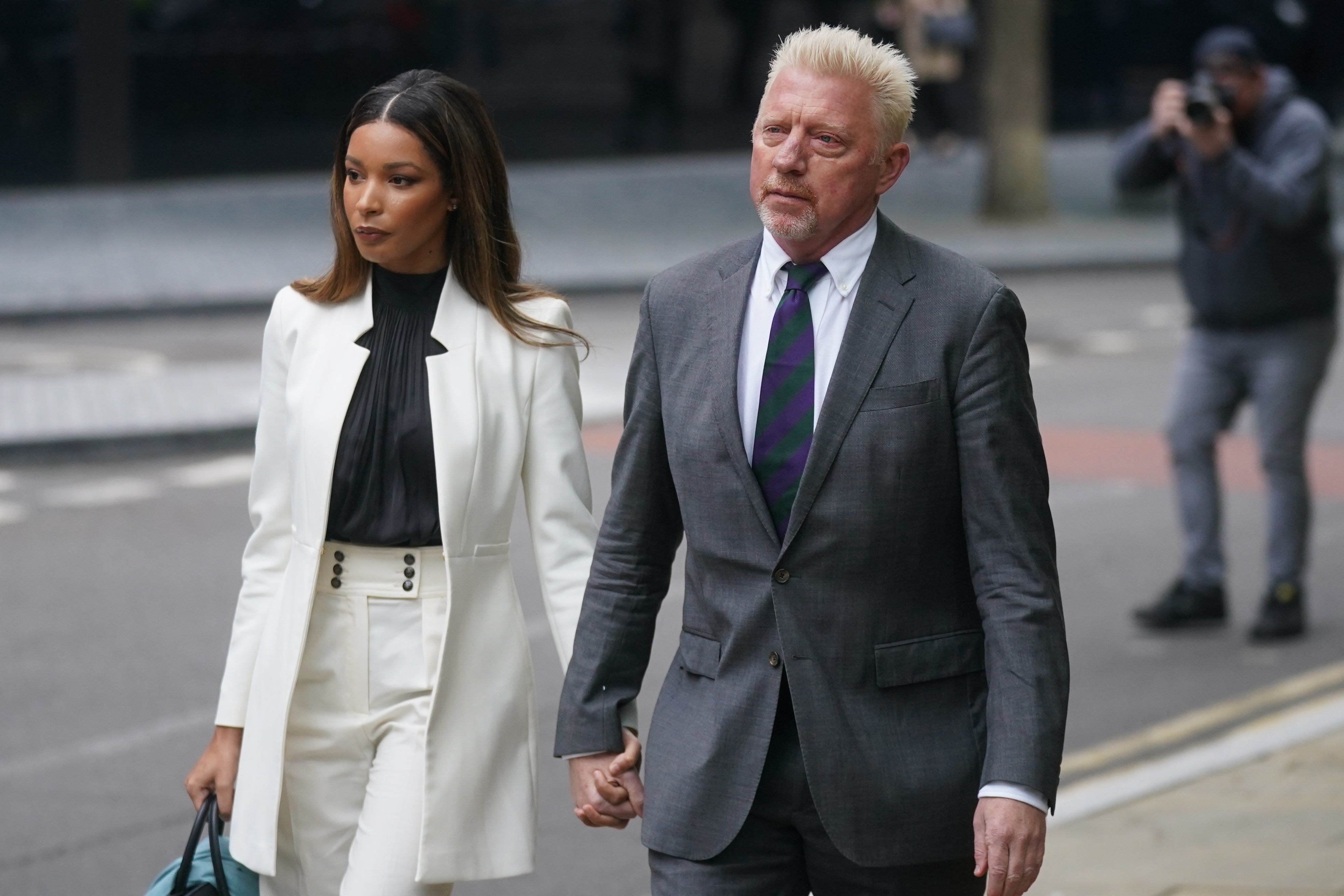 Three-time Wimbledon champion Boris Becker, arrives alongside partner Lilian de Carvalho Monteiro for sentencing at Southwark Crown Court (Victoria Jones/PA)