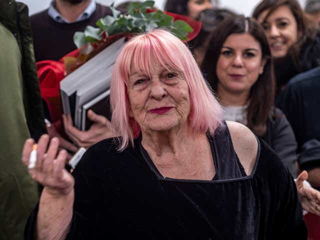 <p>The Sicilian could often be seen on an Italian Vespa motor scooter with her Leica dangling from her neck and a cigarette between her lips </p>