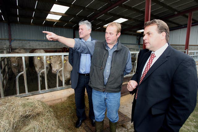 Farmer Ivan McMullan shows then MEP Neil Parish (right) and MEP Jim Nicholson (left) his farm in Carnlough Co Antrim (PA)