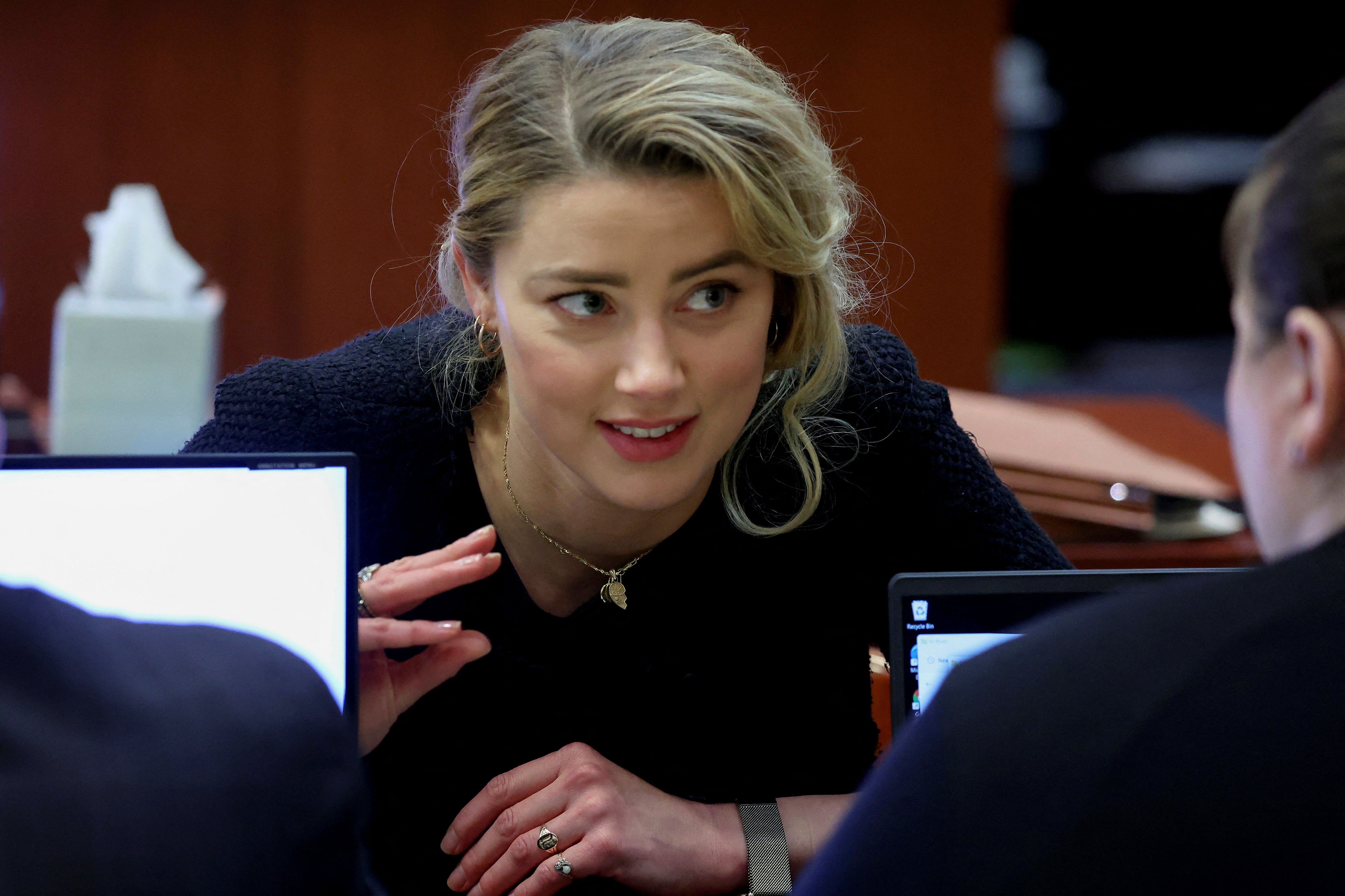 Amber Heard speaks to her legal team during her ex-husband Johnny Depp's defamation trial against her, at the Fairfax County Circuit Courthouse in Fairfax, Virginia, US on 28 April