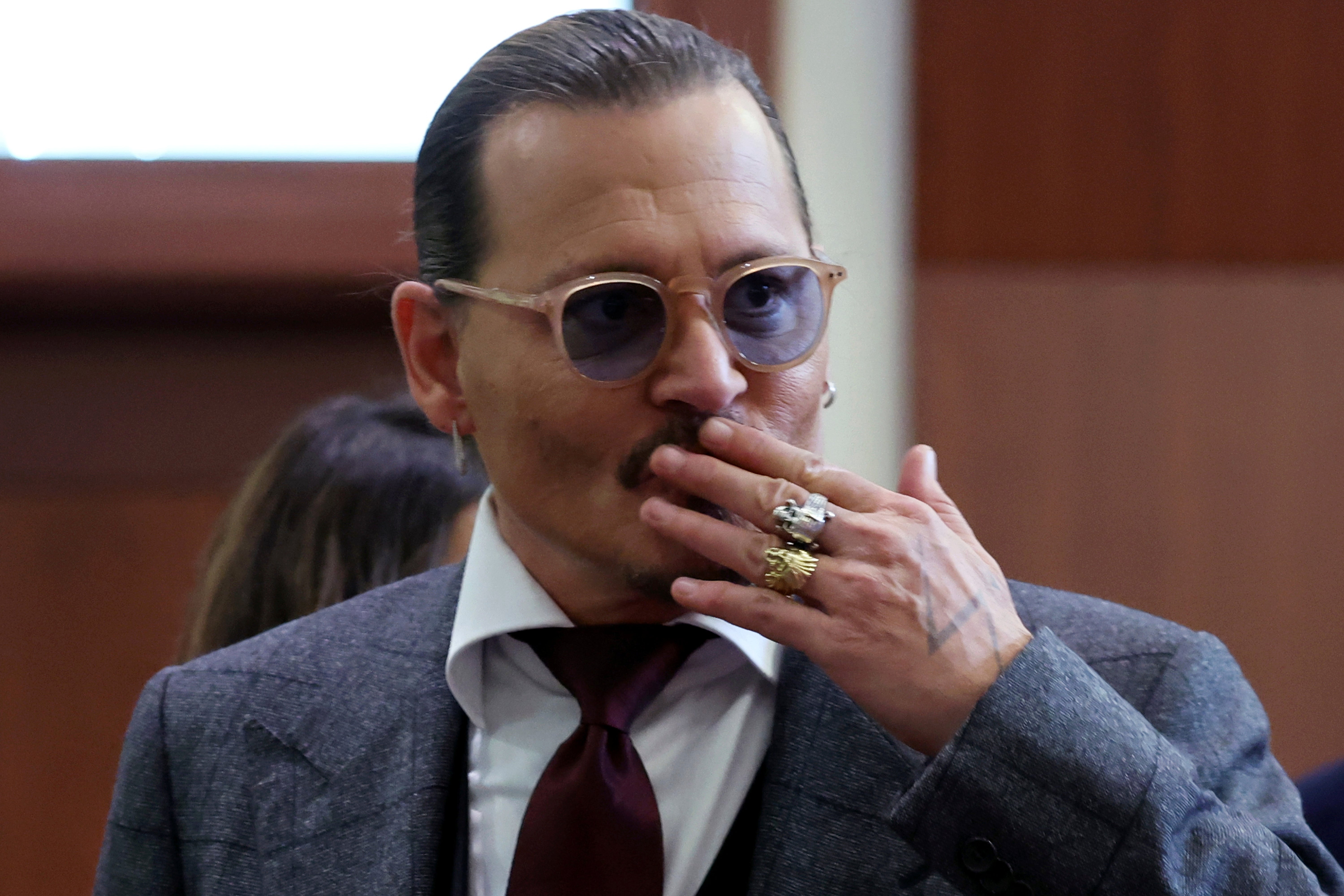 Actor Johnny Depp reacts to fans in the courtroom on Thursday