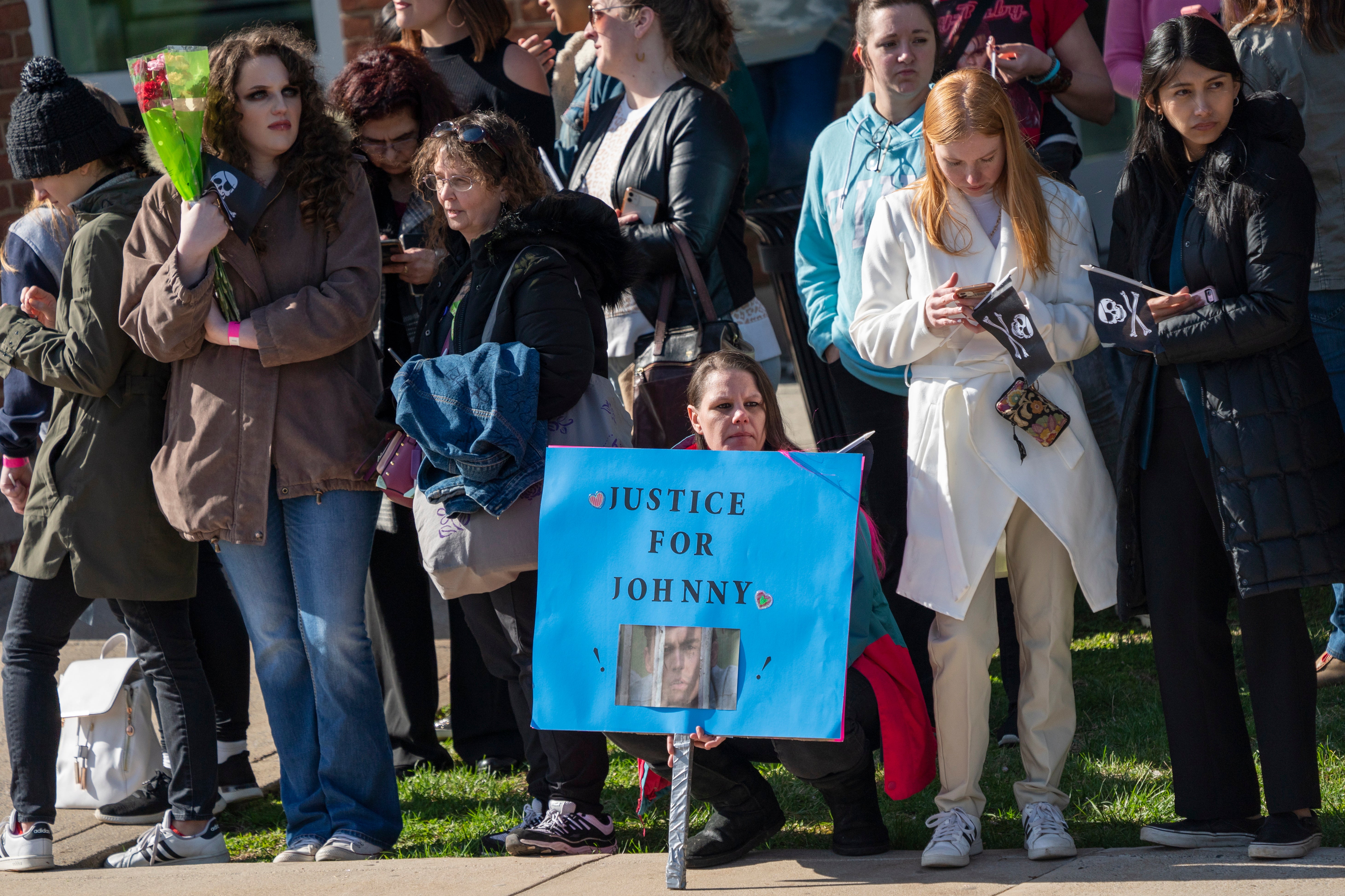 Fans wait for the arrival of Johnny Depp on day one of the trial