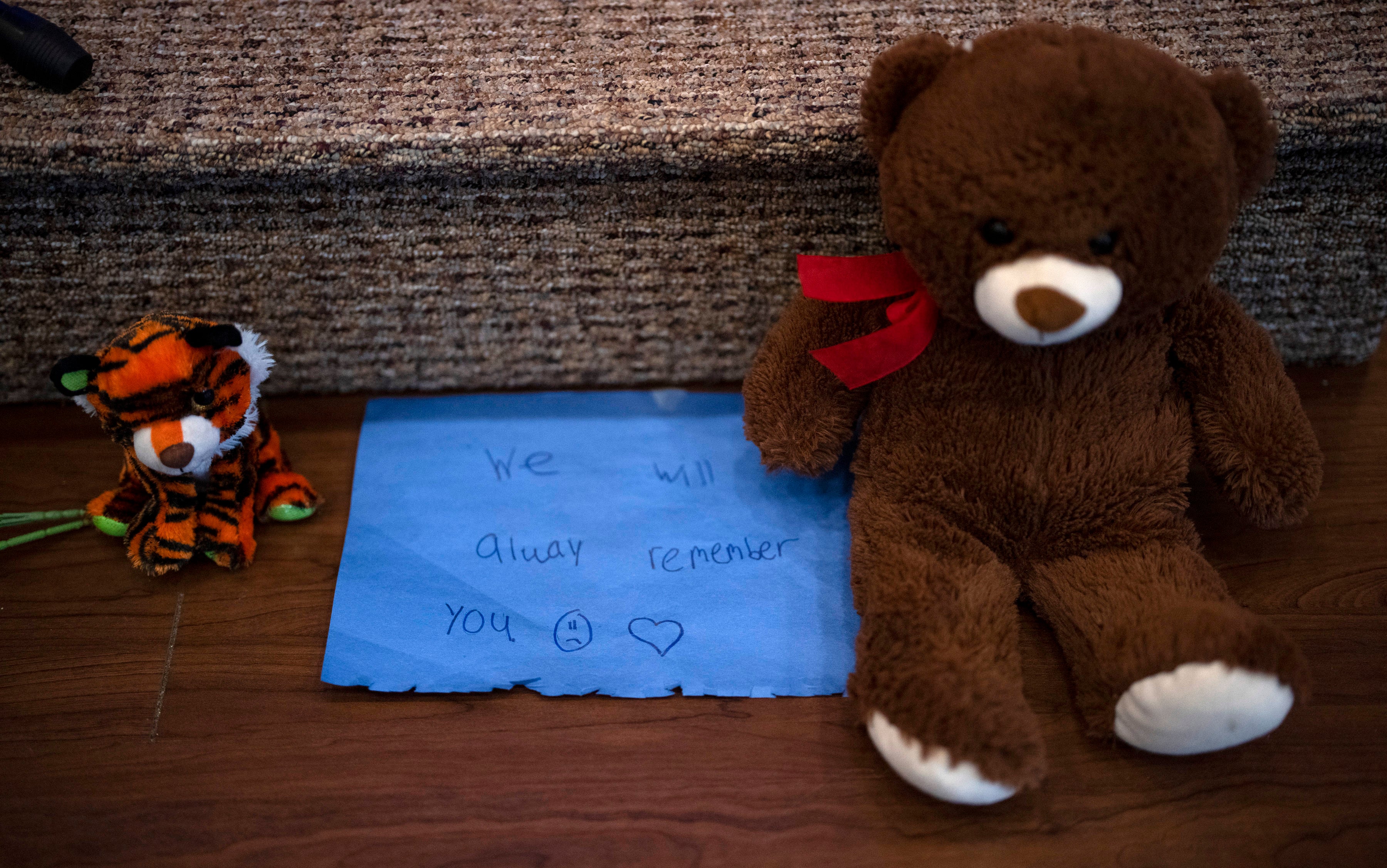 Stuffed animals are left at the altar during a prayer vigil for 10-year-old Iliana "Lily" Peters at Valley Vineyard Church in Chippewa Falls,