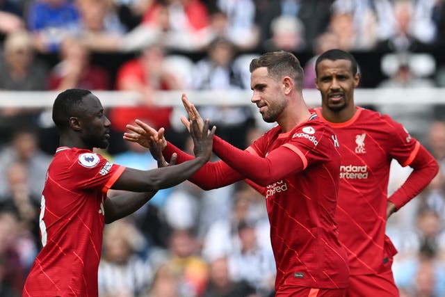 <p>James Milner (right) leaves the field after an impressive display </p>