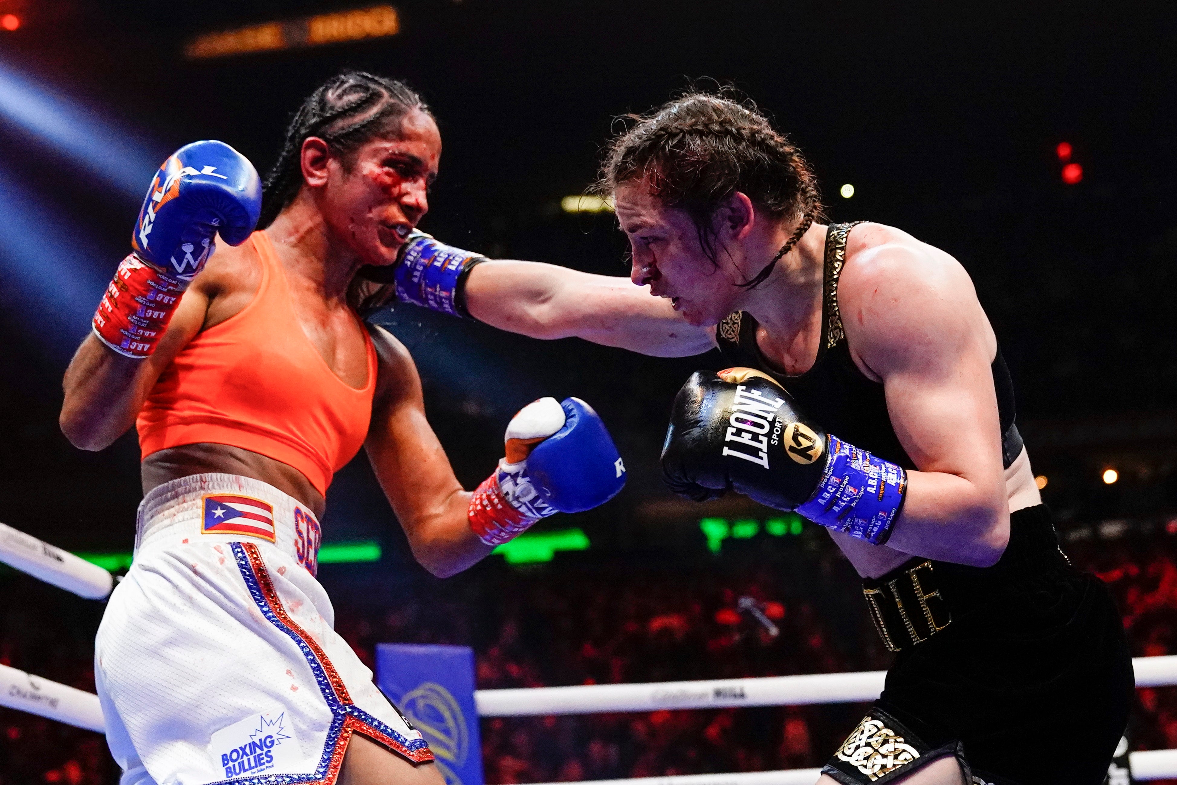 Katie Taylor (right) remained undisputed lightweight champion after edging past Amanda Serrano at Madison Square Garden
