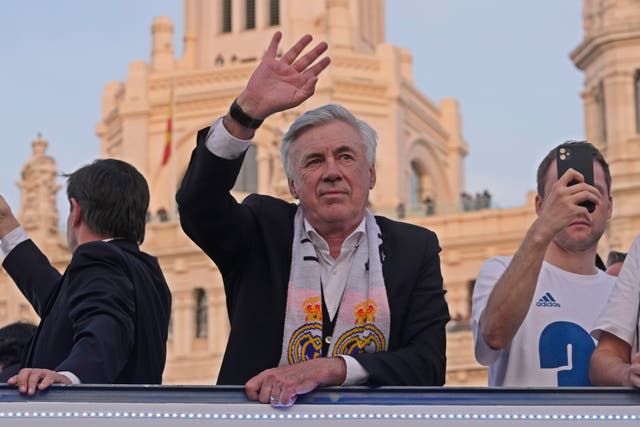 Real Madrid’s head coach Carlo Ancelotti waves during celebrations after Real Madrid won the Spanish title (AP)