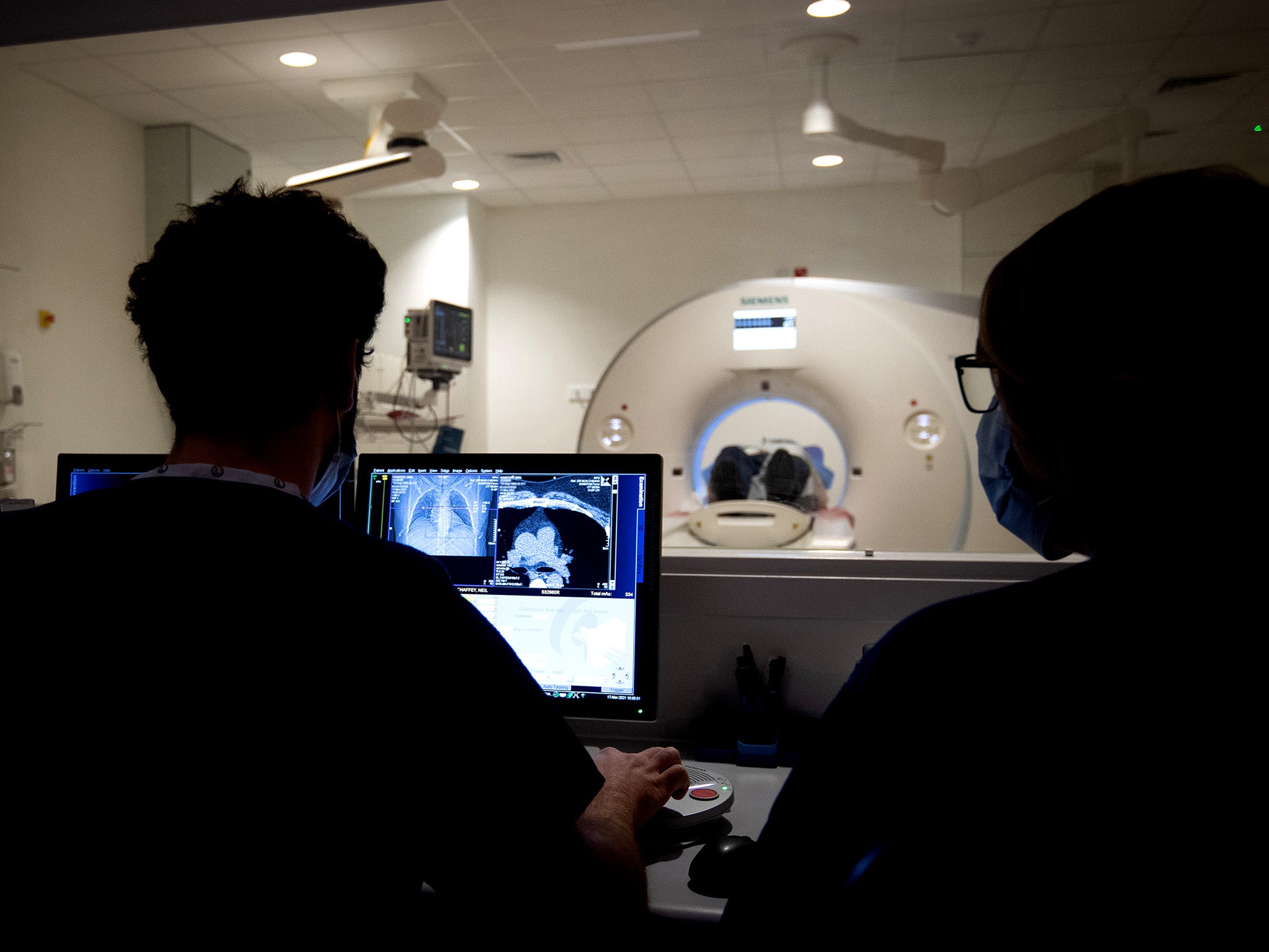 Patients waiting for scan results are unable to obtain them because of a rise in emergencies and fewer staff, says one radiologist