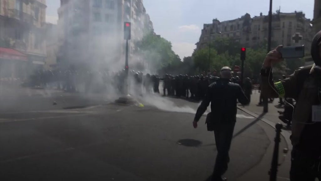 Police use tear gas during annual May Day rally in Paris a week after Macron’s election