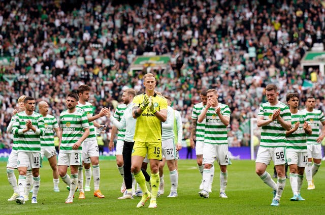 <p>Celtic players, including keeper Joe Hart (centre), applaud the fans at full time after the 1-1 Old Firm draw</p>