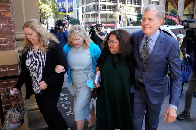 <p>The family of Scott Johnson arrive for a sentencing hearing for their brother’s killer on 2 May </p>