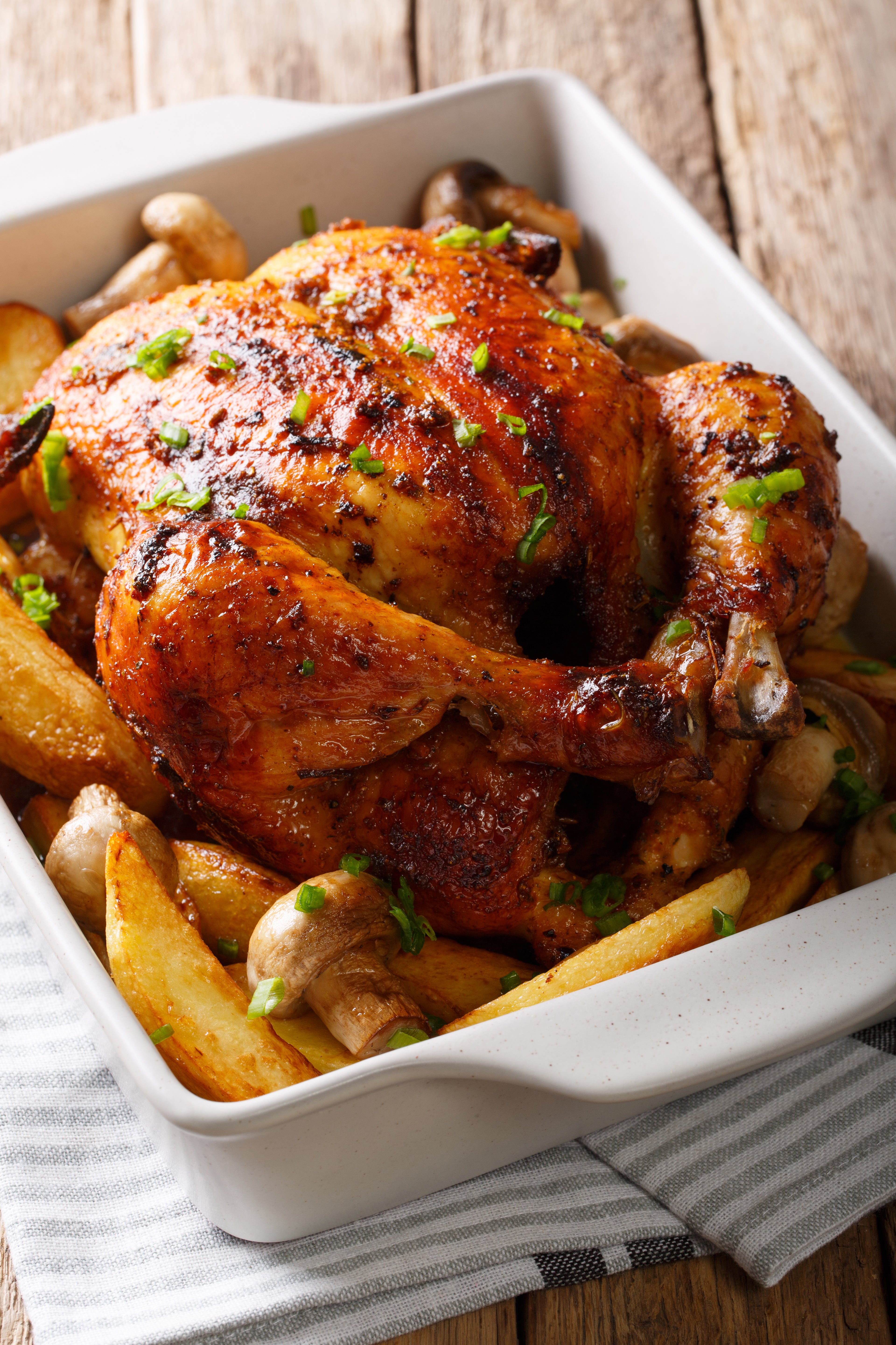 Roast the chicken over wedges of potato so thatthe drippings infuse the potatoes with incredible flavour