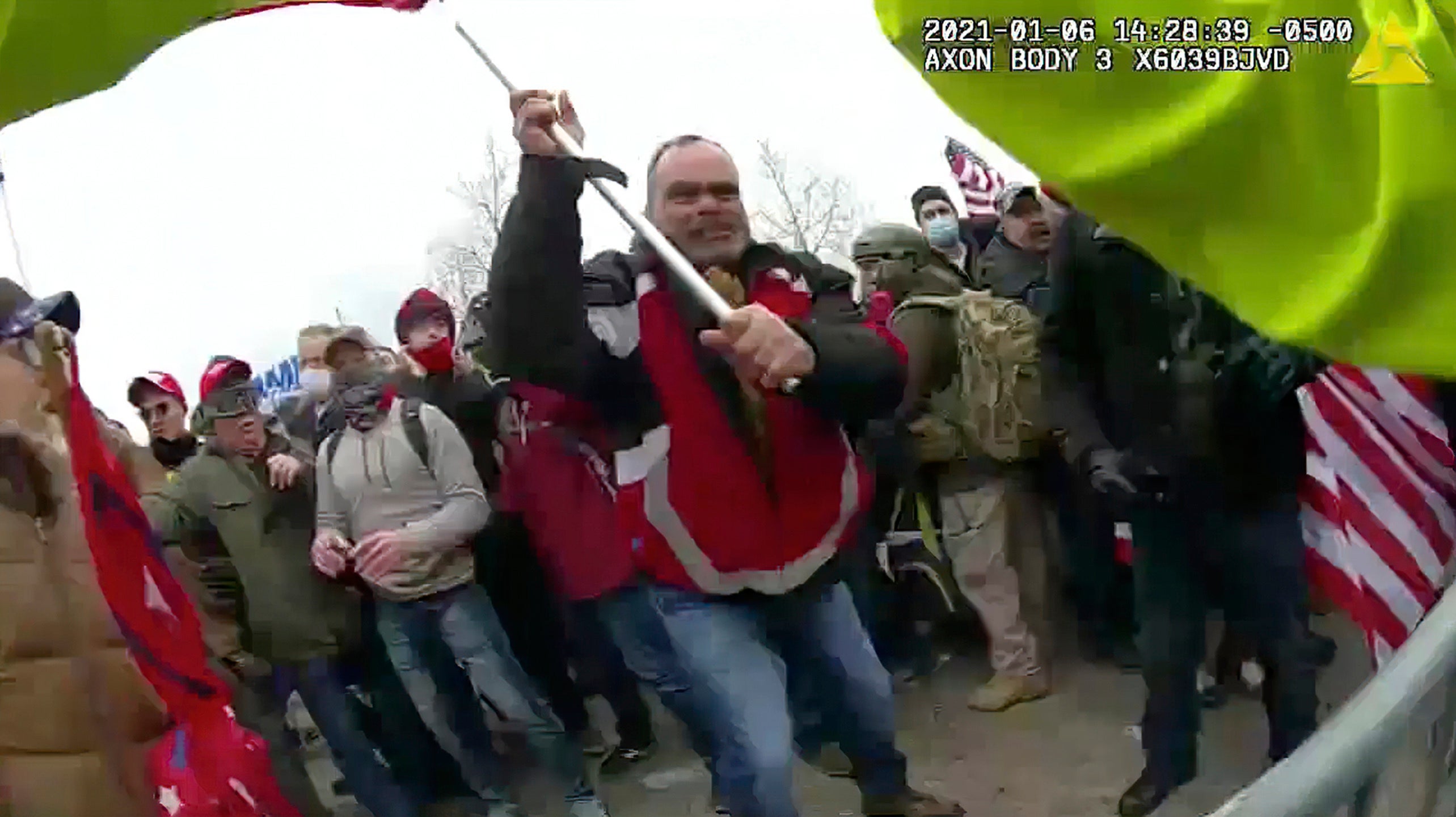 This still frame from Metropolitan Police Department body worn camera video shows Thomas Webster, in red jacket, at a barricade line at on the west front of the U.S. Capitol on Jan. 6, 2021,