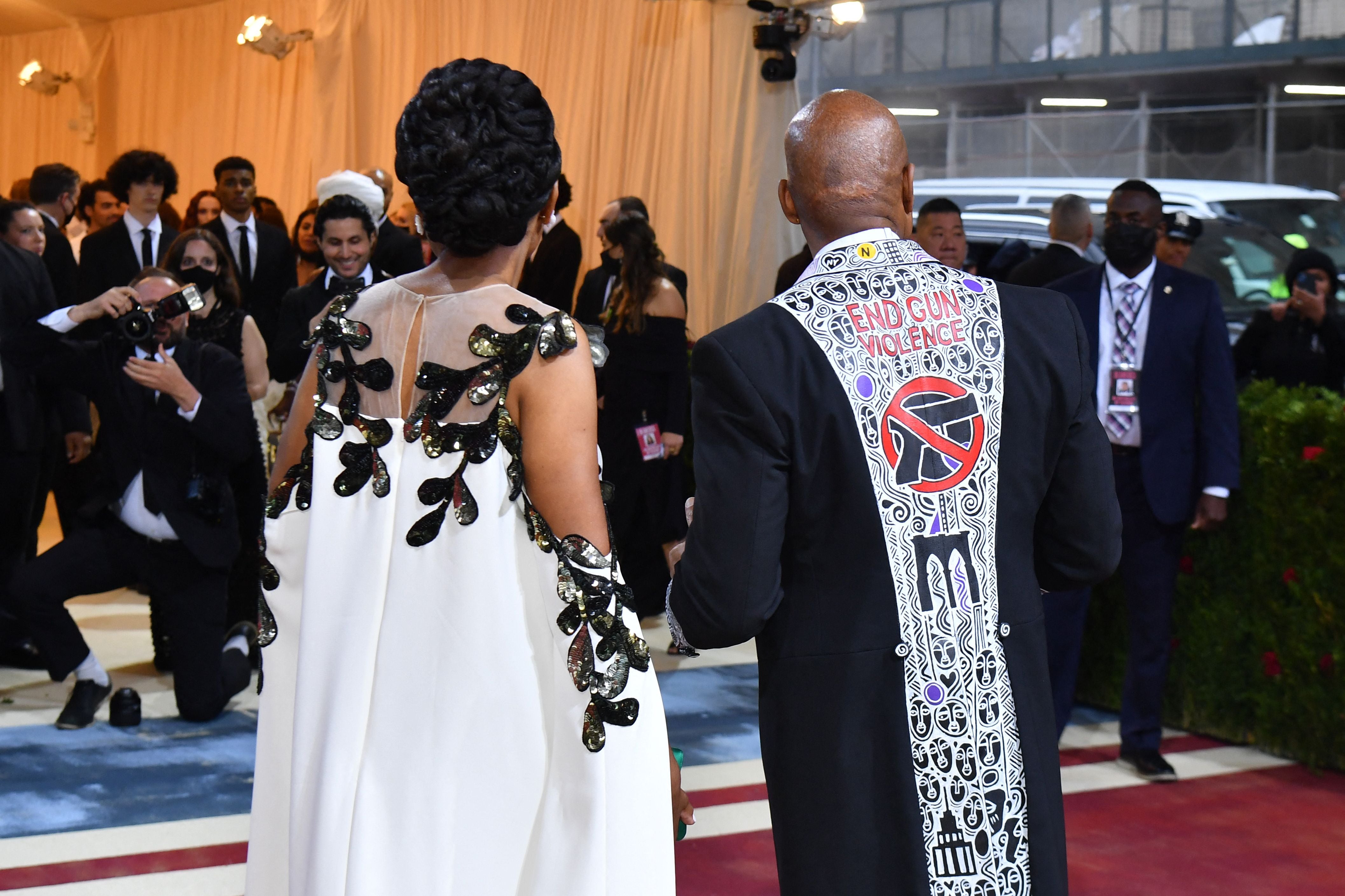 New York City Mayor Eric Adams, wearing a jacket with "End Gun Violence", and partner Tracey Collins arrive for the 2022 Met Gala at the Metropolitan Museum of Art on May 2, 2022, in New York.