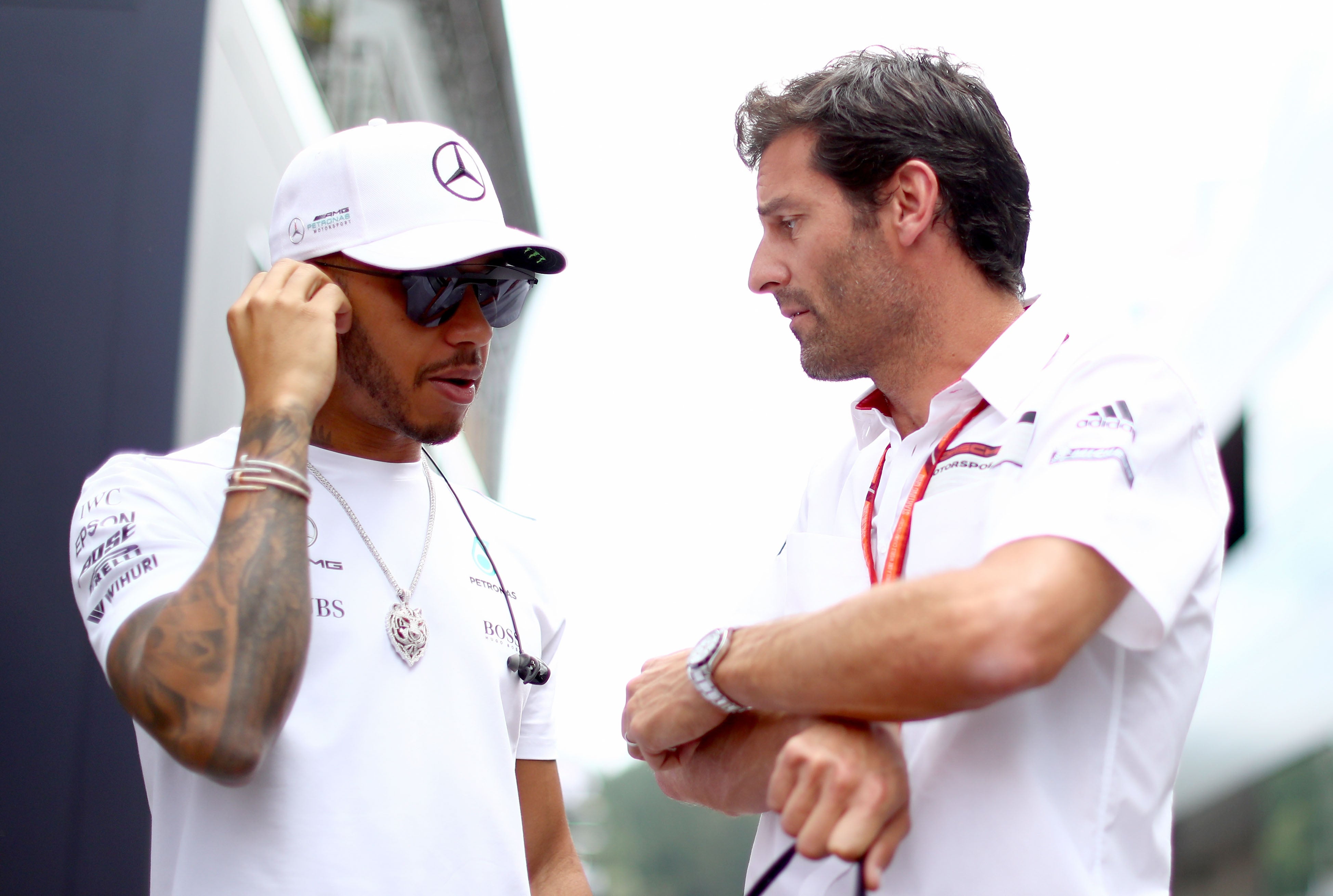 Mark Webber (right) does not believe Lewis Hamilton is at fault for his early-season struggles