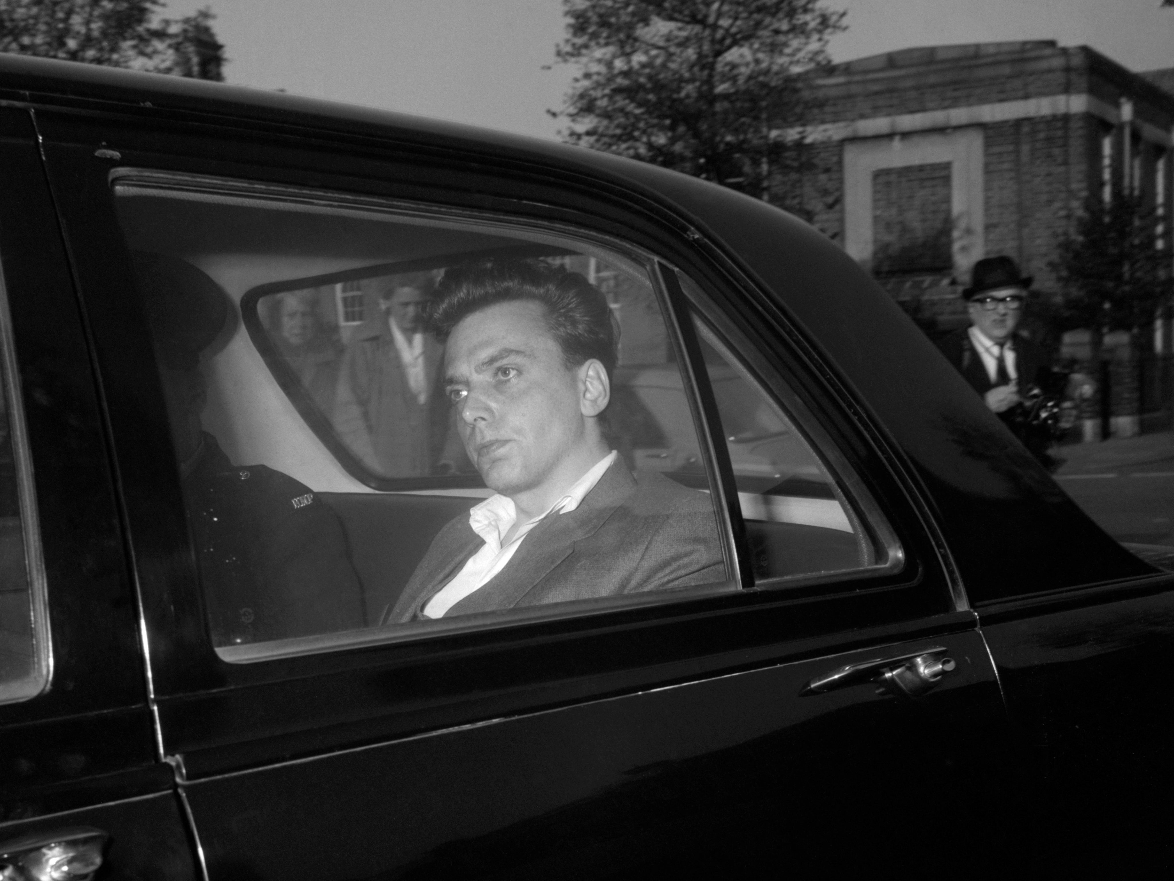 Brady in the back of a police car prior to his court appearance for the Moors Murders