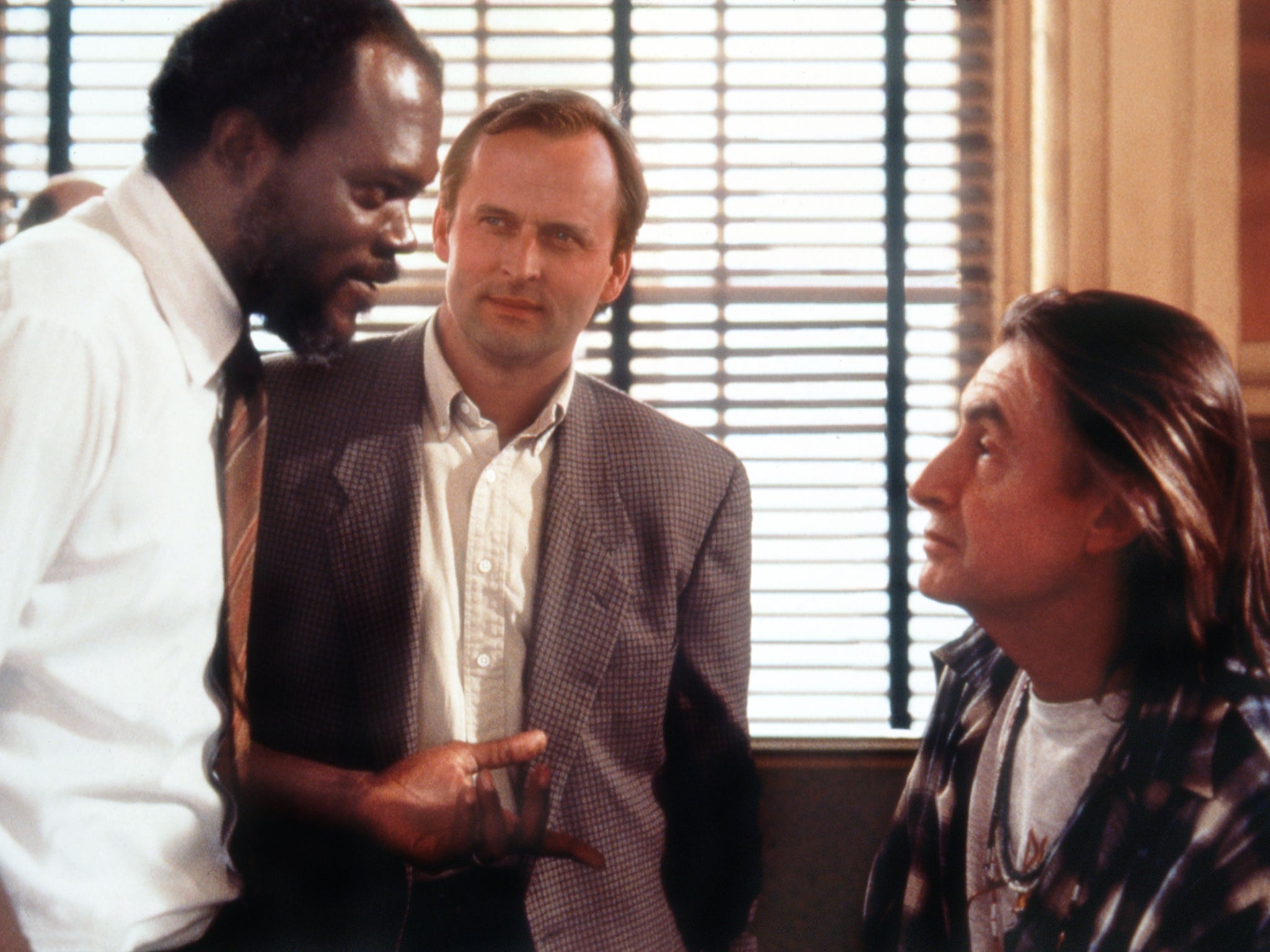 <p>John Grisham (centre) watches Samuel L Jackson and director Joel Schumacher on the set of ‘A Time to Kill'</p>