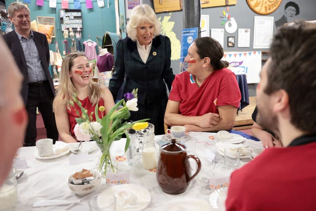 The Duchess of Cornwall, patron of both The Big Lunch and Emmaus UK, speaks with carnival performers (Chris Jackson/PA)