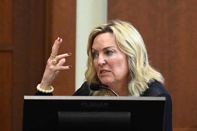 <p>Forensic psychologist Dr. Dawn Hughes, testifies during a hearing at the Fairfax County Circuit Courthouse in Fairfax, Virginia, on May 3, 2022</p>