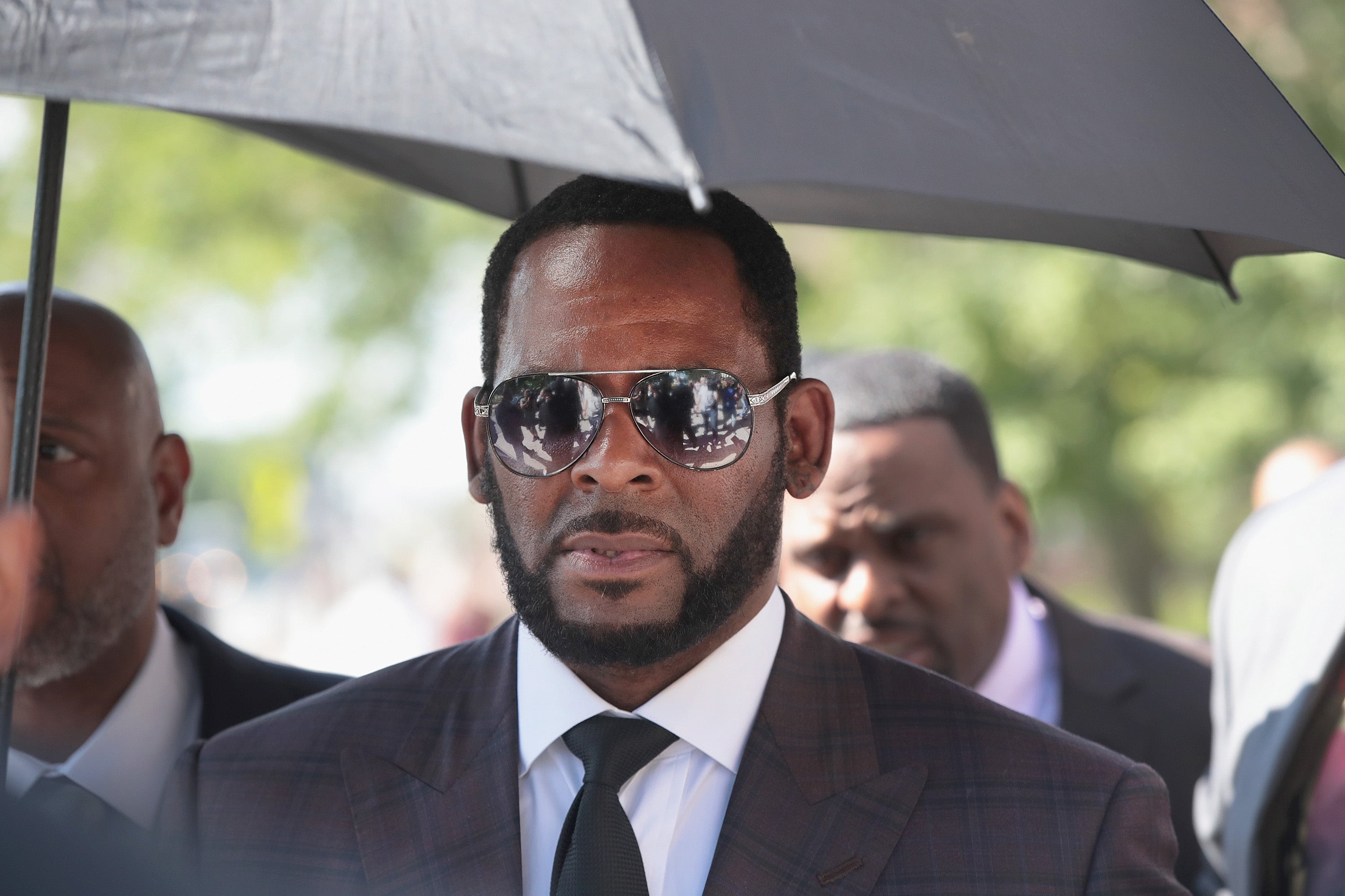 FILE: R&B singer R. Kelly leaves the Leighton Criminal Courts Building following a hearing on June 26, 2019 in Chicago, Illinois. Prosecutors turned over to Kelly's defense team a DVD that alleges to show Kelly having sex with an underage girl in the 1990s. Kelly has been charged with multiple sex crimes involving four women, three of whom were underage at the time of the alleged encounters.