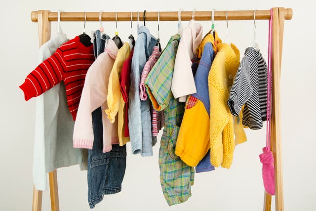 <p>A rack of children’s clothing</p>