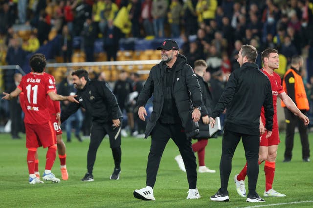 Jurgen Klopp, centre, celebrates Liverpool’s win (Alberto Saiz/AP)