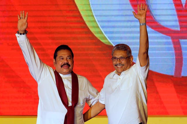 <p>Mahinda Rajapaksa (left) and his brother Gotabaya Rajapaksa wave to supporters during a party convention in 2019 </p>