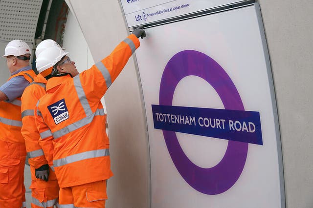 <p>Purple roundels being installed at Elizabeth Line stations</p>