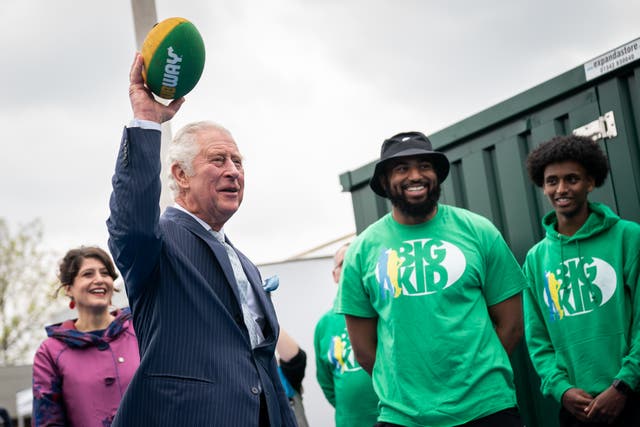 The Prince of Wales throwing an American football during a visit to the Bigkid Foundation in south London (Aaron Chown/PA)