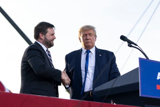 <p>JD Vance shakes Donald Trump’s hand at a 23 April rally in Ohio, weeks ahead of the state’s primary election</p>